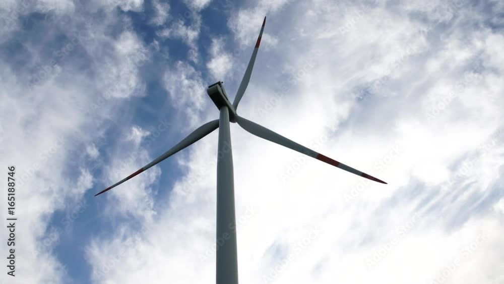 Wind turbines moving and a blue skye with clouds, 4K Wind turbines moving and a blue skye with clouds, 4K