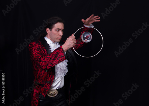 The juggler have a balanse ball on the spoon photo
