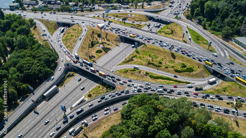 Aerial top view of road junction from above, automobile traffic and jam of many cars, transportation concept
Aerial top view of road junction from above, automobile traffic and jam of many cars, transportation concept