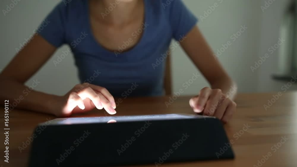 Woman working on tablet computer Woman working on tablet computer
