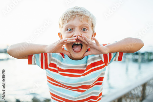 boy yells loudly