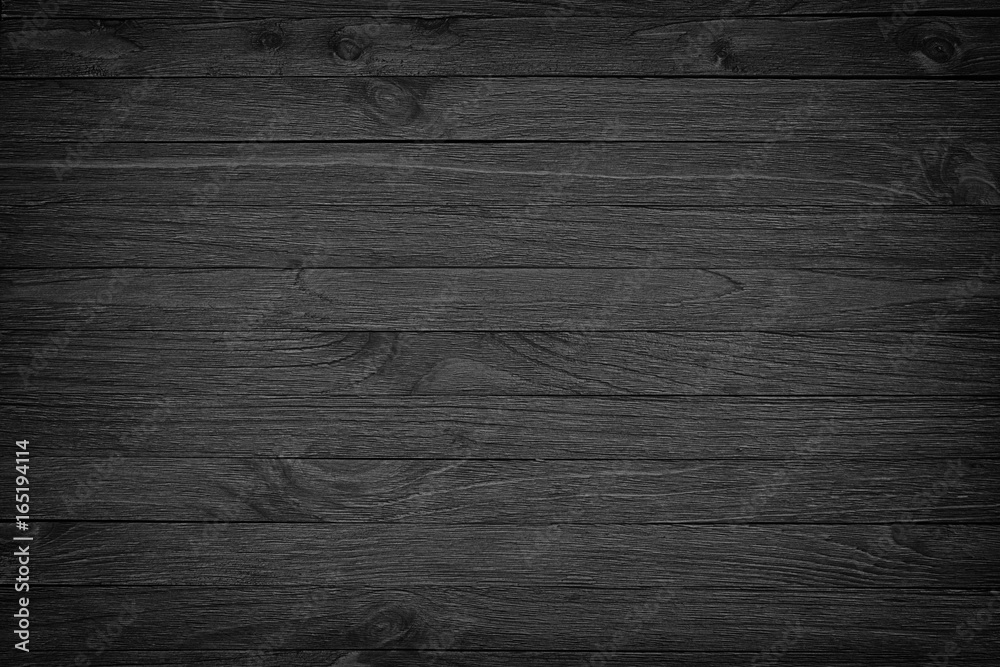 Obraz premium black wooden background or gloomy wood grain texture