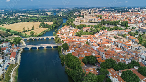 Aerial top view of Beziers town, river and bridges from above, South France
