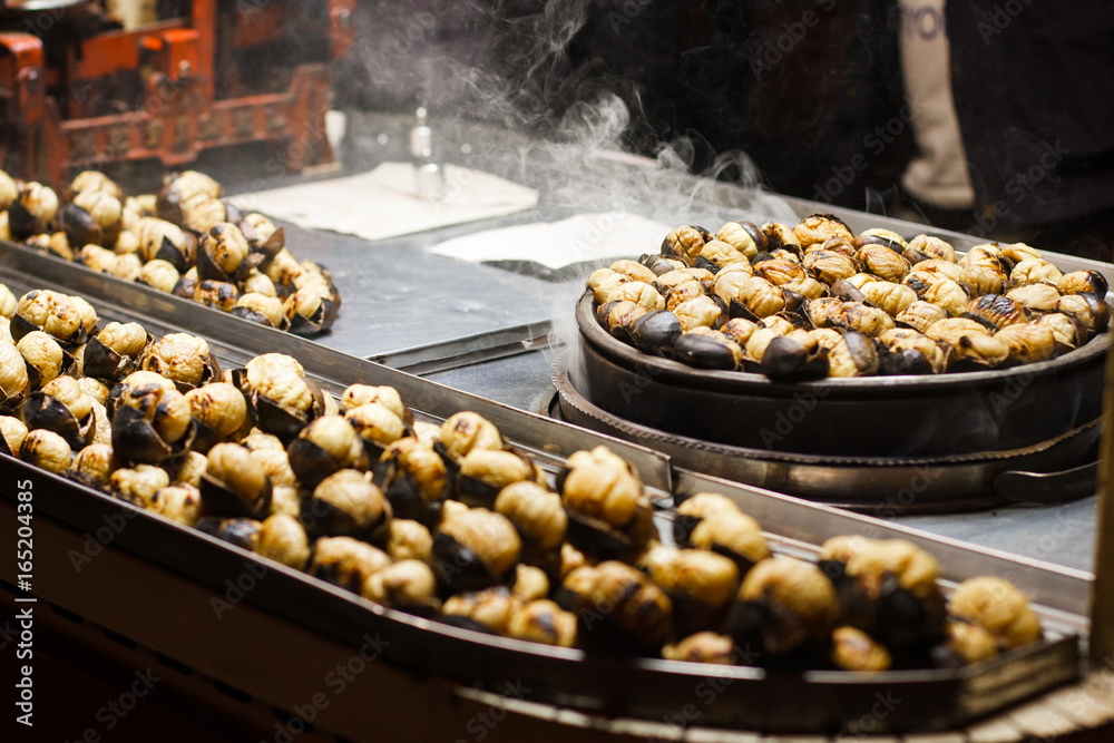 Turkish roasted chestnuts street shop evening background .