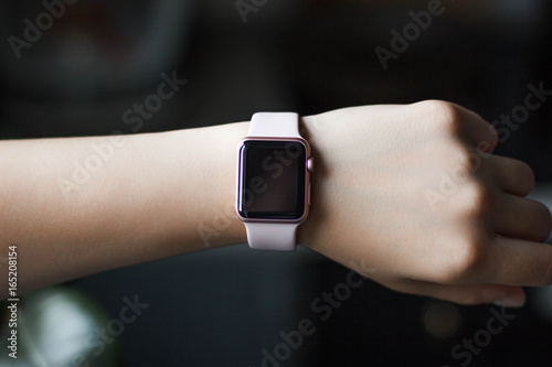 Apple watch on the hand closeup black background. photo