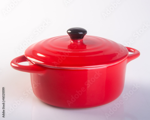 pot or red pot with cover on background.