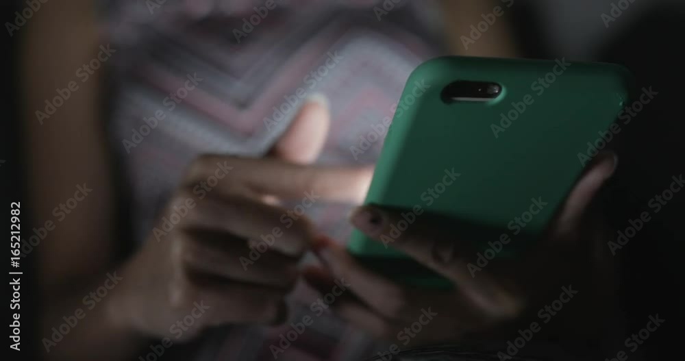 Woman use of smart phone at night Woman use of smart phone at night