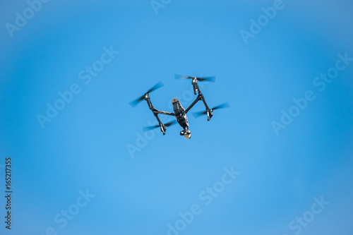 Fototapeta Naklejka Na Ścianę i Meble -  Drone in sky/Dron-quadrocopter soars in sky