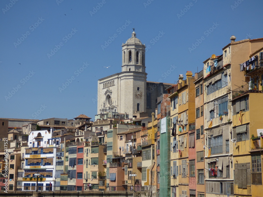 Colorful houses in Girona, Catalonia, Spain with the cathedral above the river Ter