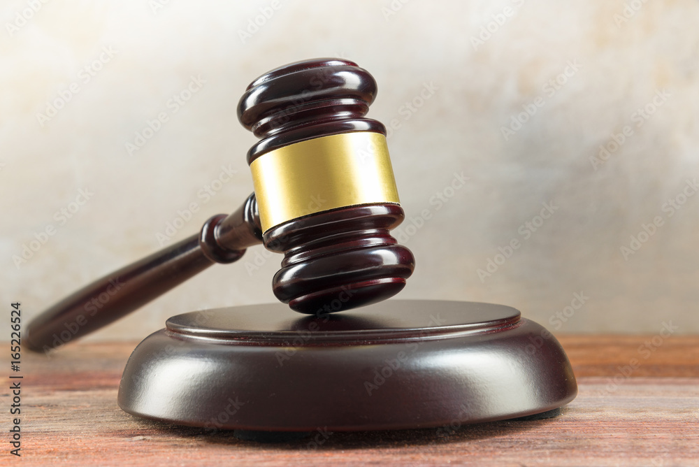 Judge gavel and sound board on a wooden desk, justice symbol and concept for social justice in law and court, copy space Judge gavel and sound board on a wooden desk, justice symbol and concept for social justice in law and court, copy space
