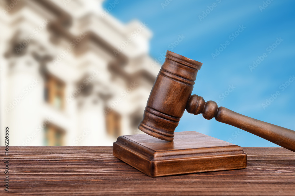 Judge's gavel and courthouse on background. Concept of law Judge's gavel and courthouse on background. Concept of law