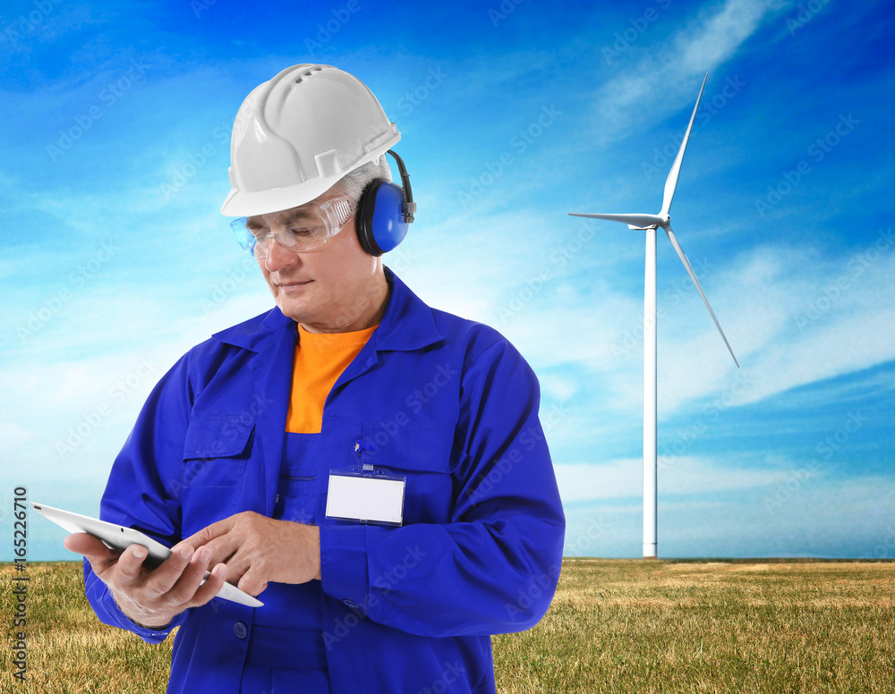 Construction worker with tablet, isolated on white Construction worker with tablet, isolated on white