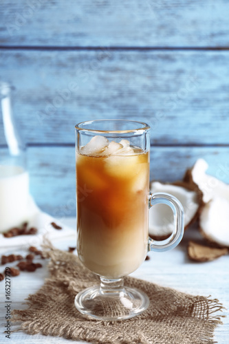 Glass of cold tasty coconut coffee on table © Africa Studio