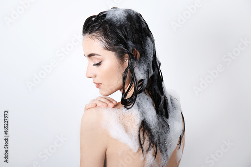 Young woman taking shower o...