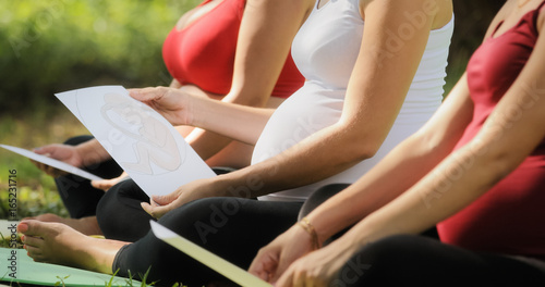 Pregnant Women In Prenatal Class With Images Of Baby photo