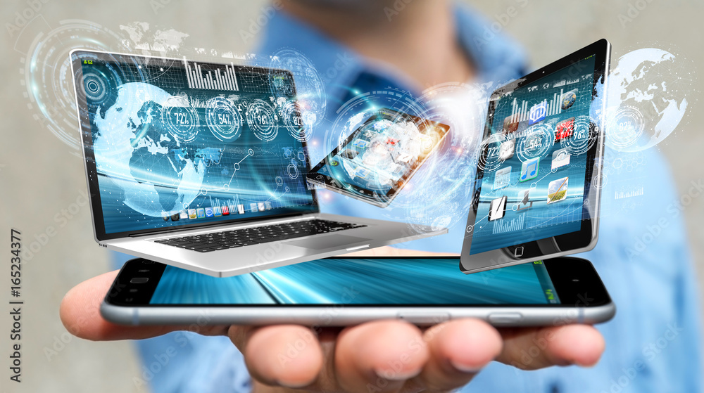 Businessman connecting tech devices with his mobile phone 3D rendering Businessman connecting tech devices with his mobile phone 3D rendering