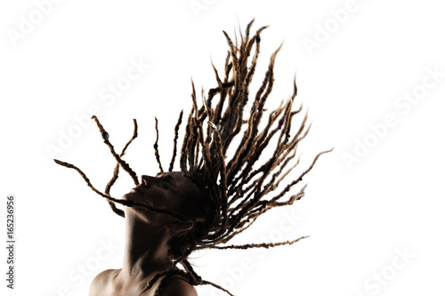 girl with dreadlocks in the air photo