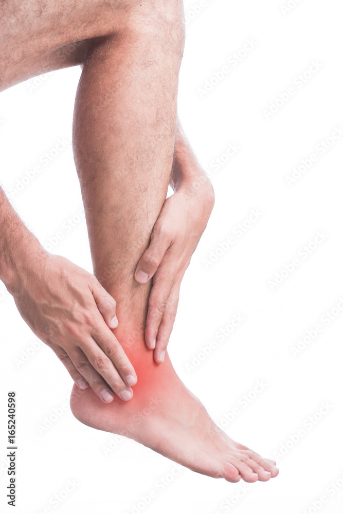Studio shot of young man with ankle pain
Studio shot of young man with ankle pain