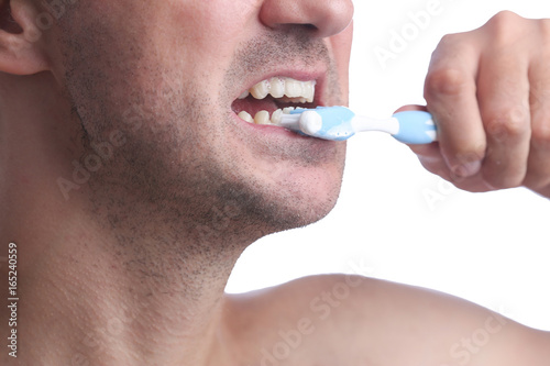 Close-up Of Man Brushing His Teeth