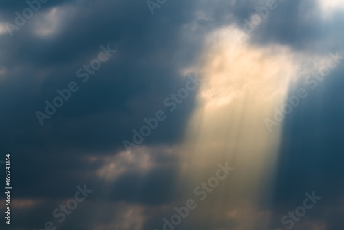 Sun rays through clouds like an dramatic explosion © happystock