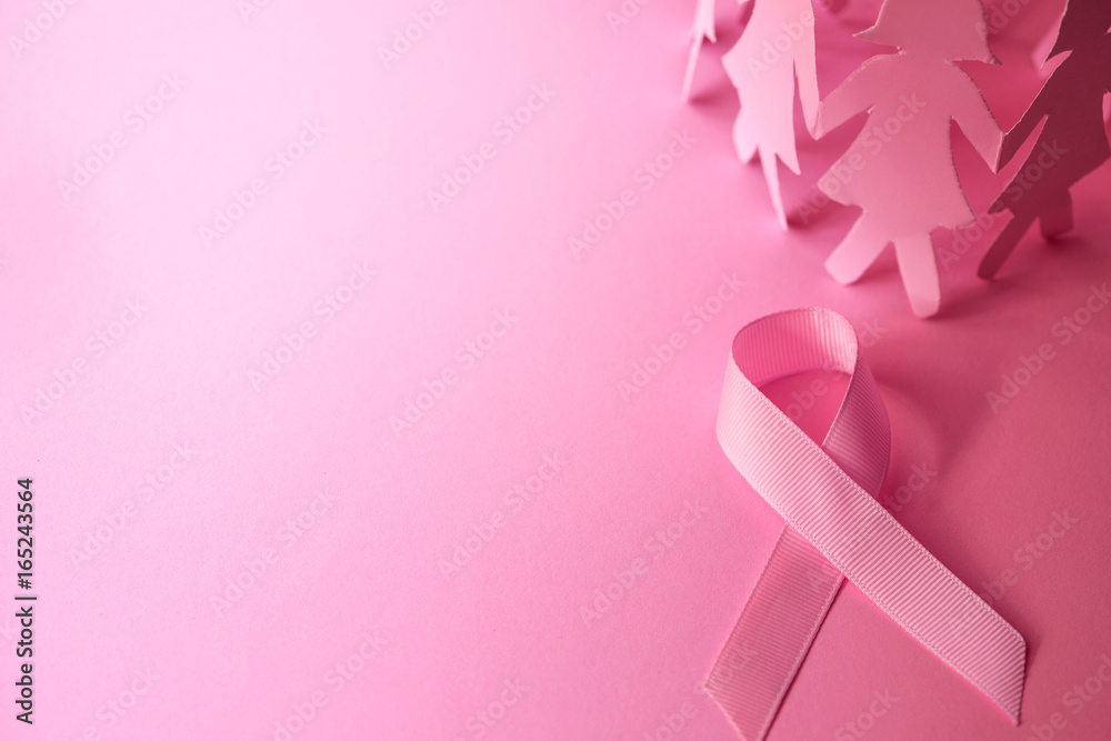 Sweet pink ribbon shape with the girl paper doll on pink background  for Breast Cancer Awareness symbol to promote  in october month campaign