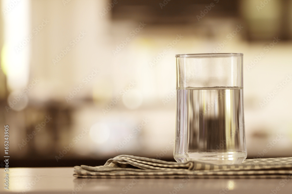 the Glass of purified water on the table bar in kitchenroom the Glass of purified water on the table bar in kitchenroom