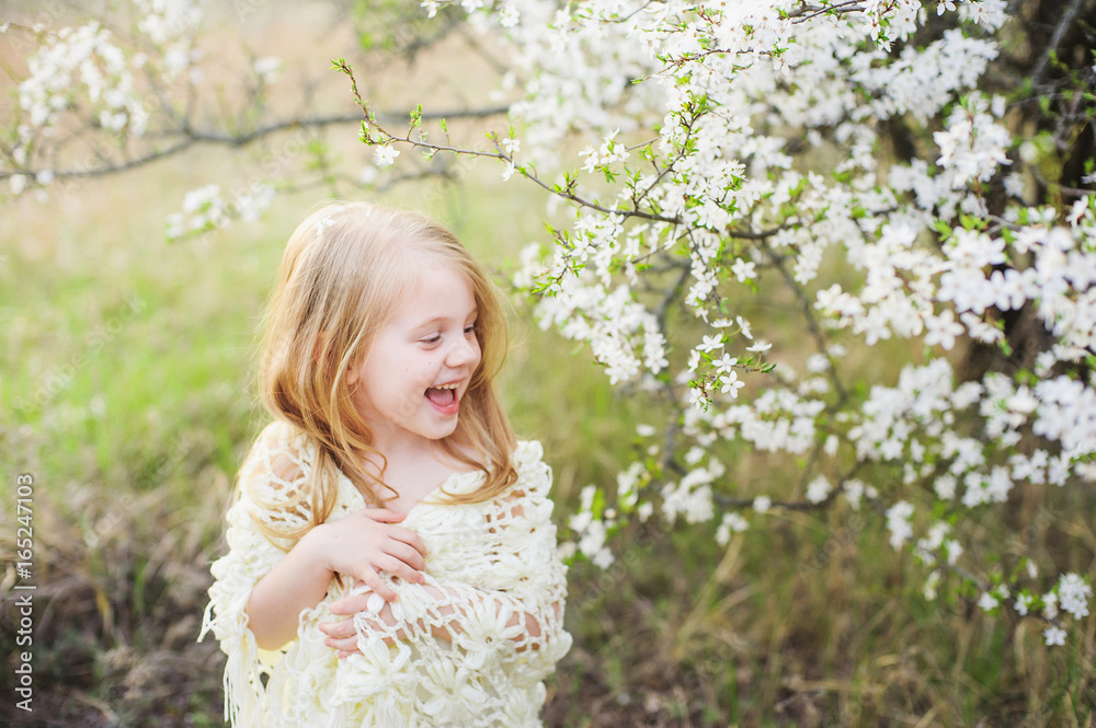 Beautiful little girls in dresses walking in the park