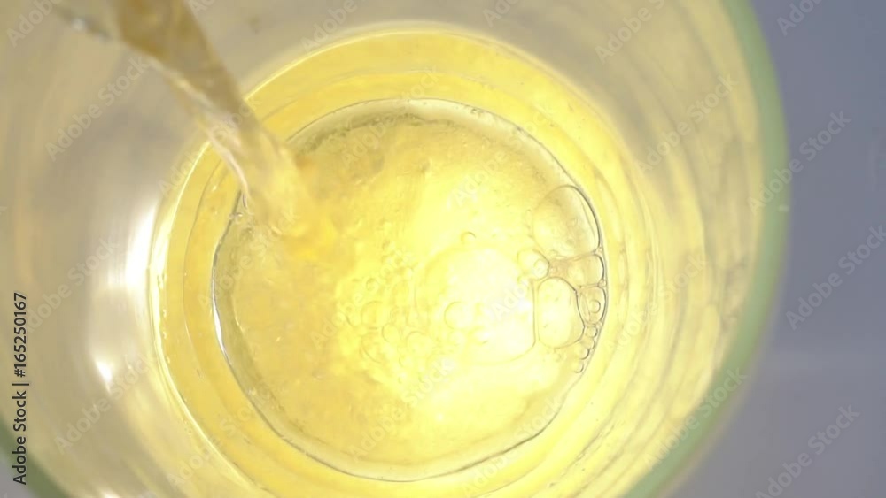 Beer is poured into a glass, getting a beer foam. Top view. Slow motion. 1920x1080 Beer is poured into a glass, getting a beer foam. Top view. Slow motion. 1920x1080