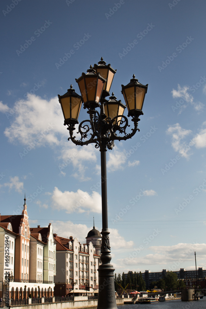 vintage street lantern on blue sky background