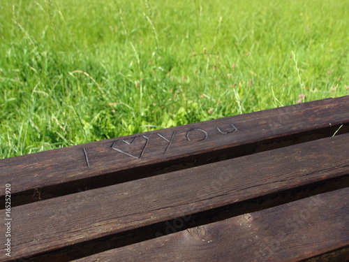 I Love You with a Heart Carved into a Wooden Bench