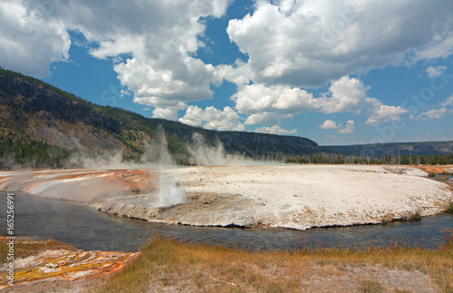 Iron Spring Creek and Cliff Geyser in Black Sand Basin in Yellowstone National Park in Wyoming United States