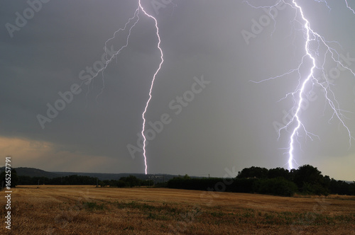 Close lightning strikes in the forest and the valley (Dordogne, France)