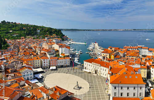 Oval-shaped main Tartini square,old stone houses, narrow streets, port and small boats in Piran, Slovenia.