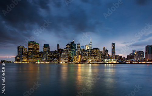 Cloudy day at Lower Manhattan Skyline view from Brooklyn Bridge Park  New York United States