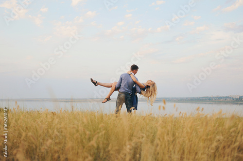 Young couple: the guy and the girl on walk, love story