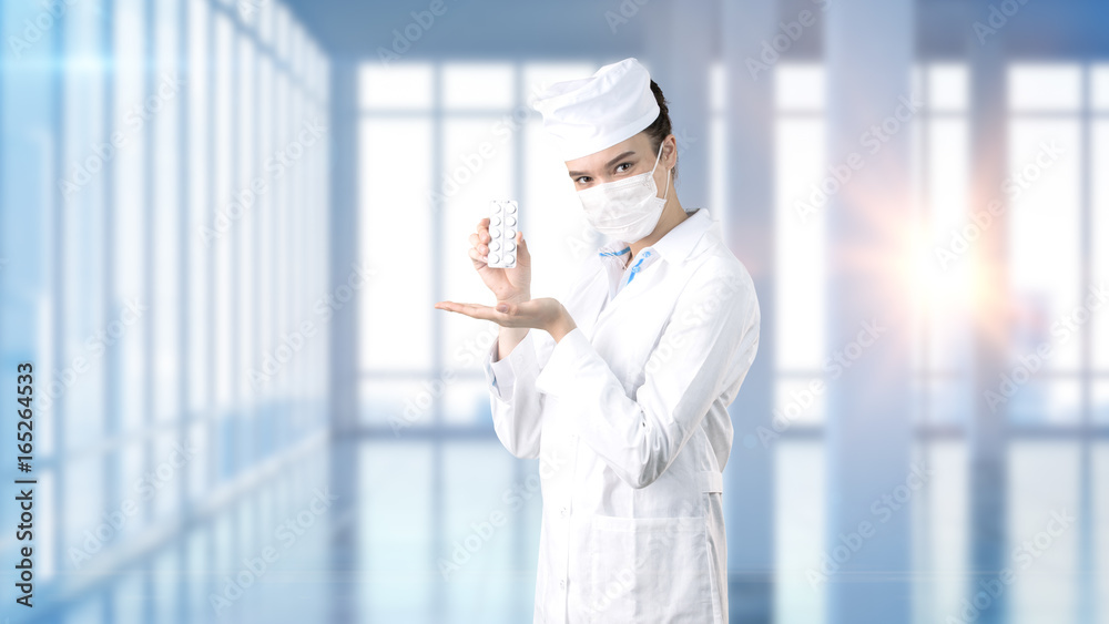 Beautiful medical woman doctor in uniform. Studio painted background. Concept of profitable health care. Beautiful medical woman doctor in uniform. Studio painted background. Concept of profitable health care.