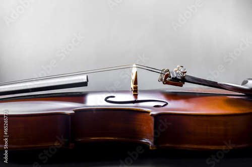 The violin on the table, Close up of violin on the wooden floor, Top view of violin musical on dark wooden floor
