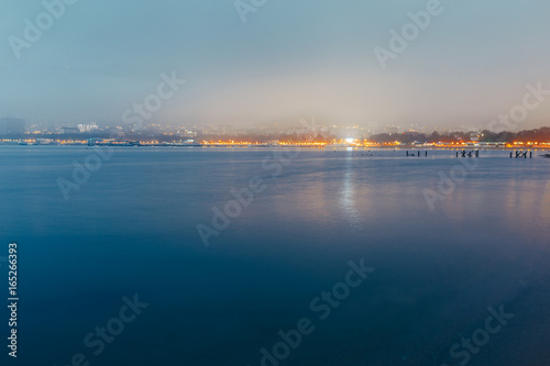 City By The Sea At Sunset In Fog On Background Of Harbor. Picturesque Evening Landscape. Gelendzhik, Russia