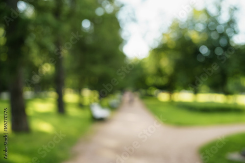 abstract blurred background of city park in sunny summer day