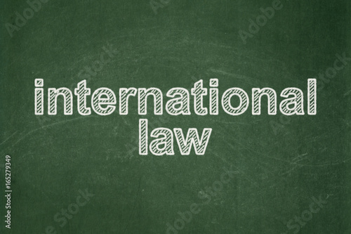 Politics concept: International Law on chalkboard background