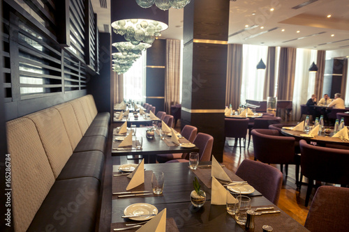 Fotografie Interior of restaurant. Wooden design.