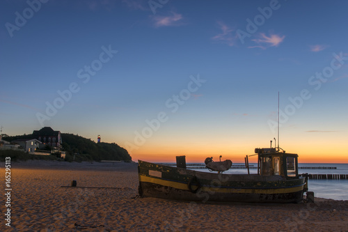 Fishing boat on the beach in the evening