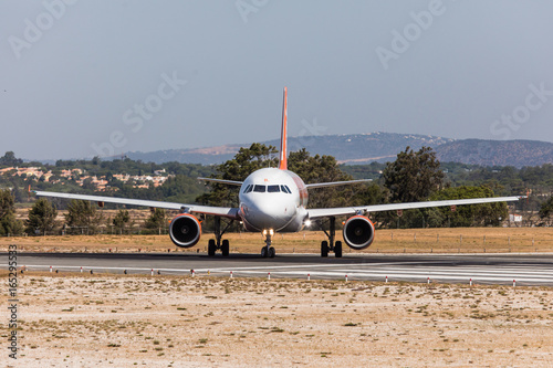 Obraz na plátně FARO, PORTUGAL - Juny 18, 2017 : easyJet Flights aeroplane departure from Faro International Airport