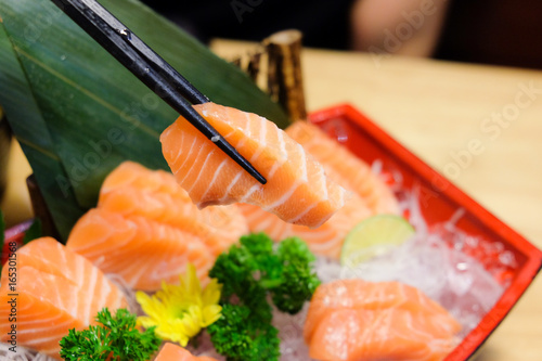 Salmon sashimi set with chopsticks
