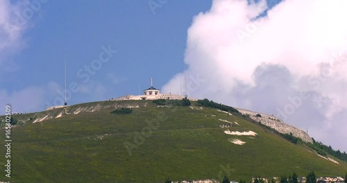 Sacrario militare del monte grappa con nuvove in movimento photo