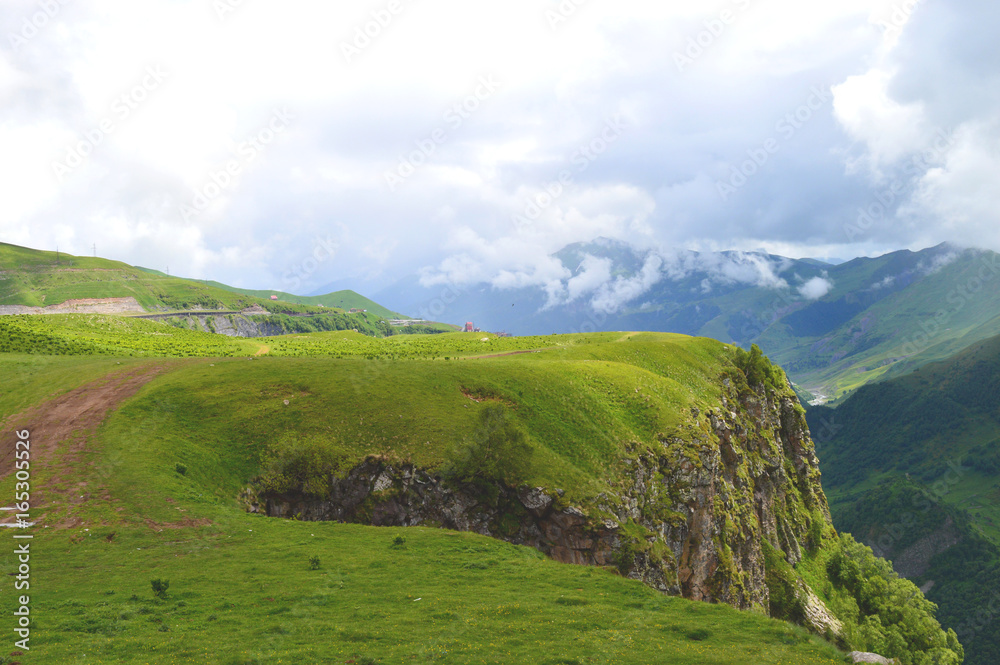Obraz premium Georgian green cloudy mountains