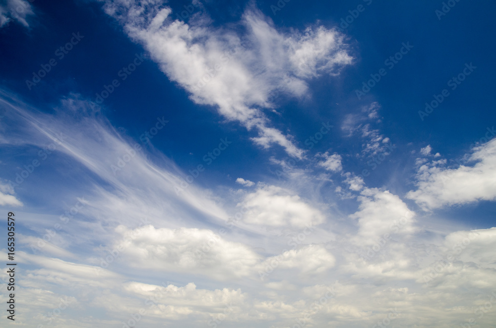 White clouds in deep blue summer sky, natural sky background