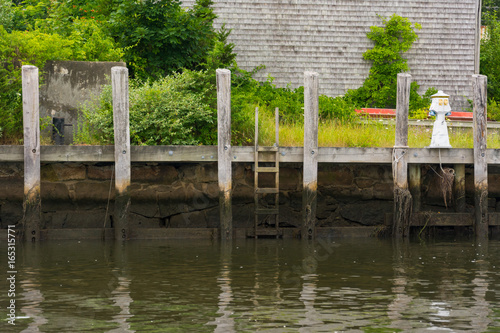 Empty dock along retaining wall in Wareham Harbor