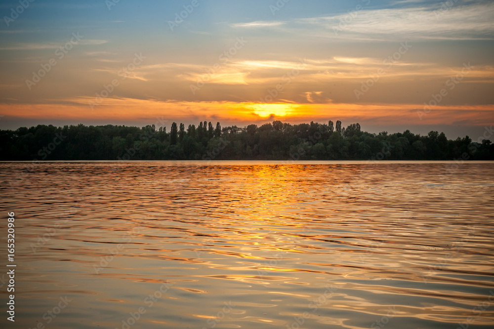 beautiful majestic sunset on the background of the river bank with no people in Dnipro Kiev Ukraine beautiful majestic sunset on the background of the river bank with no people in Dnipro Kiev Ukraine