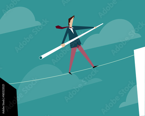 Businessman walking on a tightrope